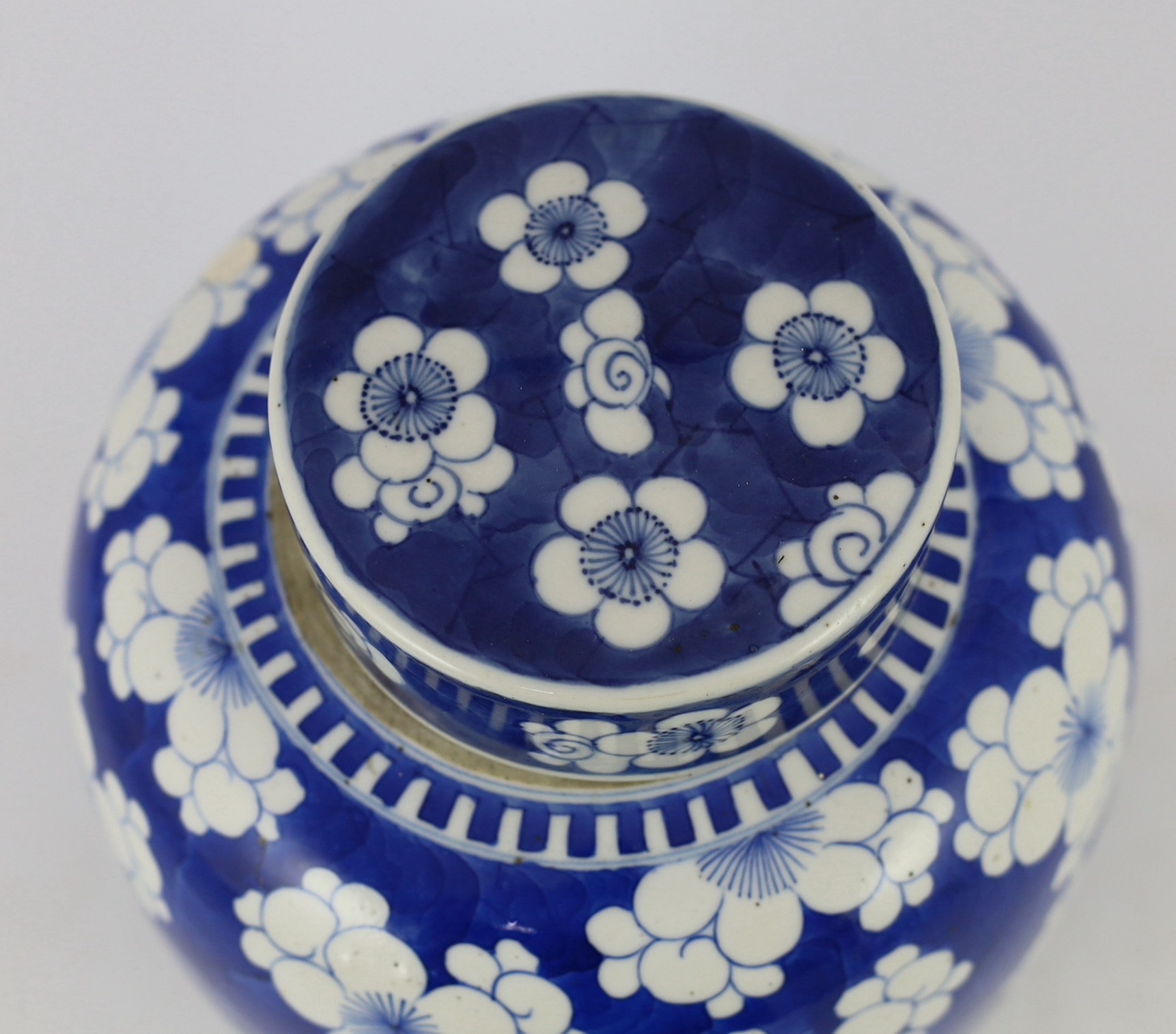 A Chinese blue and white prunus jar and cover, 19th century, 25cm high, cover associated